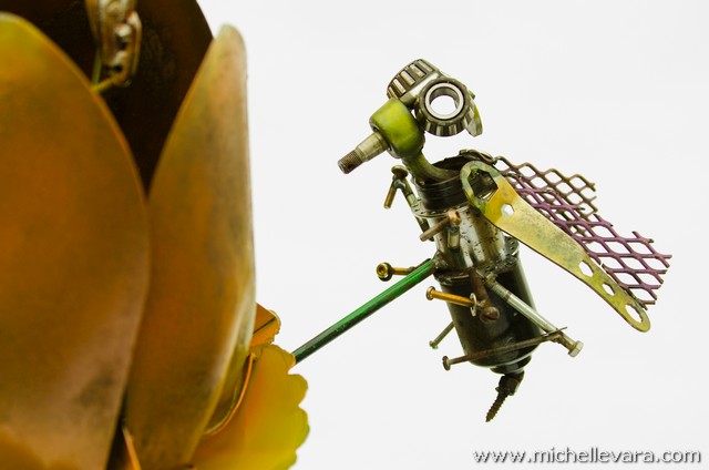 Large Tulips and bee's made from recycled welded material, finished in handmade paint.