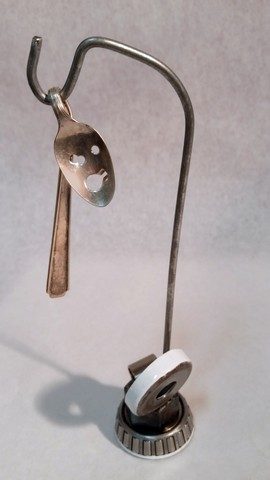 kachina, metals welded with enamel paint accents. Sculpture that wears like Jewelry.