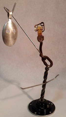 Kachina, metals welded with enamel paint accents. Sculpture that wears like Jewelry.