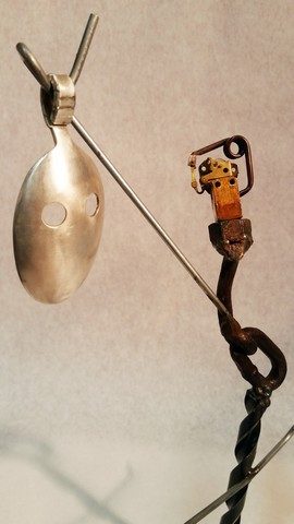 Kachina, metals welded with enamel paint accents. Sculpture that wears like Jewelry.