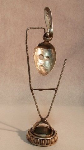 Kachina, metals welded with enamel paint accents. Sculpture that wears like Jewelry.