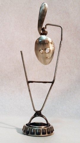 Kachina, metals welded with enamel paint accents. Sculpture that wears like Jewelry.