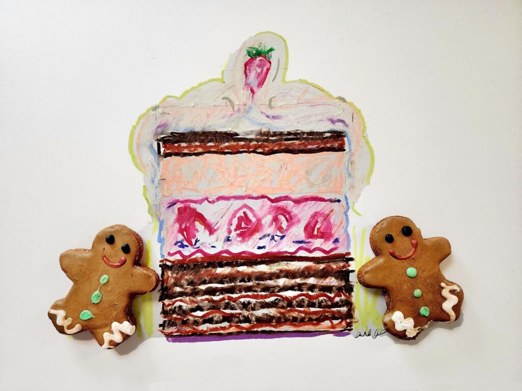 Cake Art, Drawing with oil pastel on artist paper with baked gingerbread people.